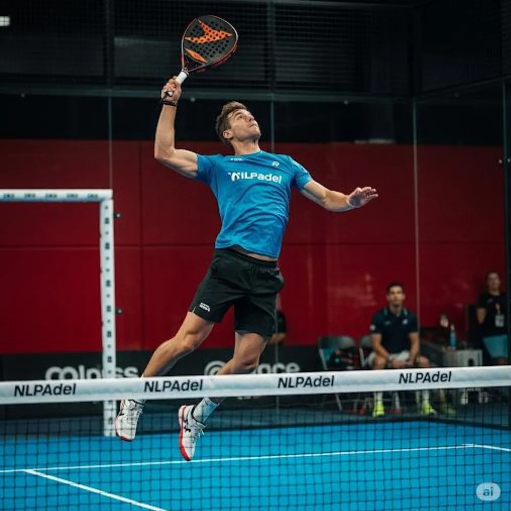 NLPadel athlete performing a powerful shot during a paddle game
