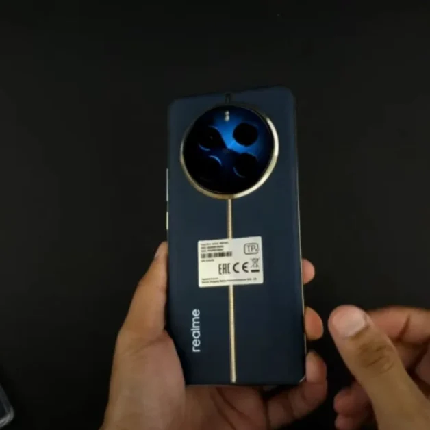Realme 12 Pro Plus smartphone in black with circular triple camera design.