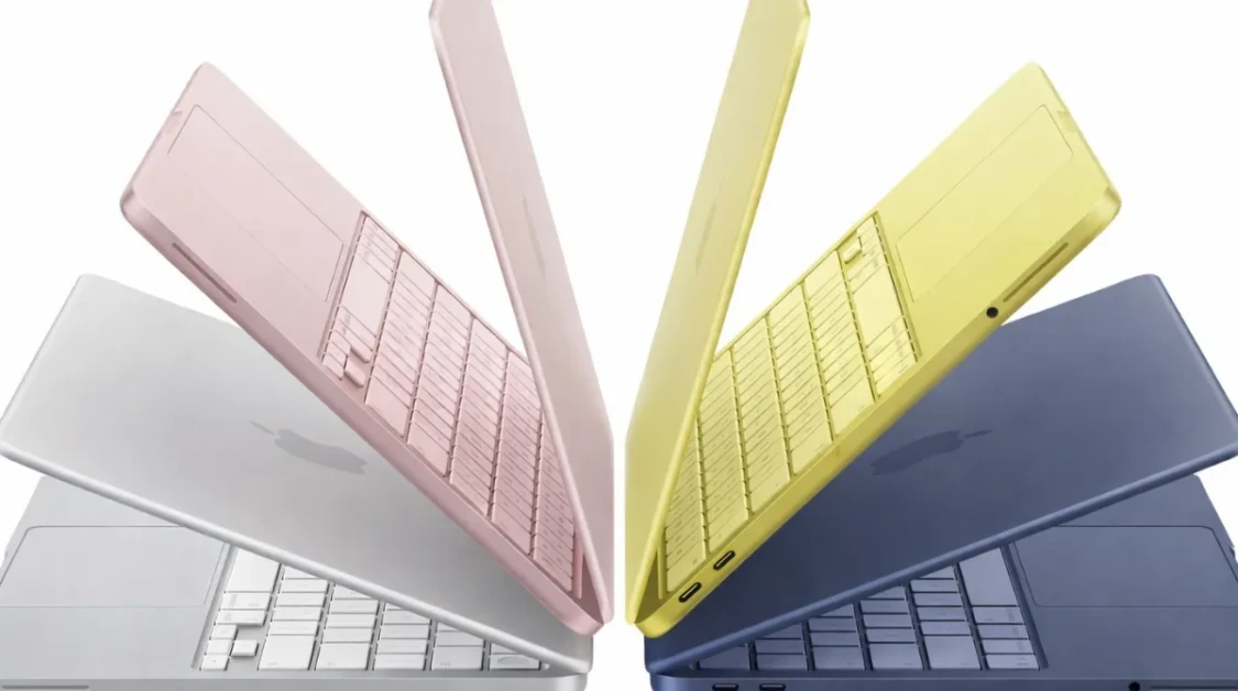 MacBook Neon laptops in four colors arranged in a symmetrical fan display on a clean white background.