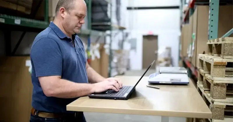 A man working on automated warehouse management system